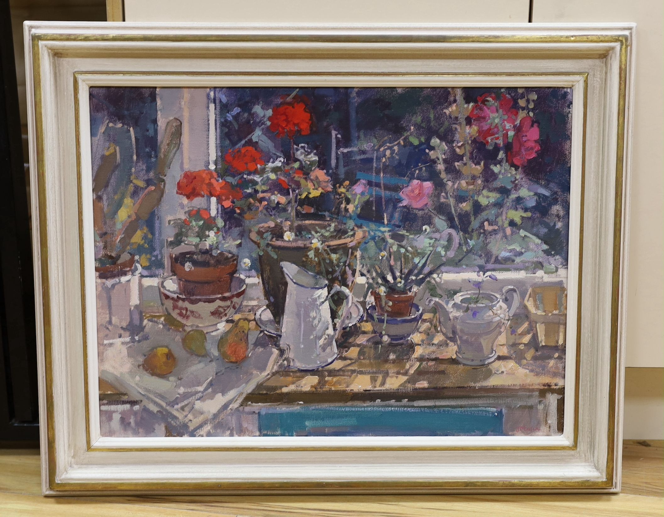 John Martin RBA (b.1957), oil, Still life of Pelargoniums on a window sill, signed, 44 x 60cm